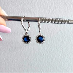 Silver tone faux diamond and sapphire dangling pierced earrings